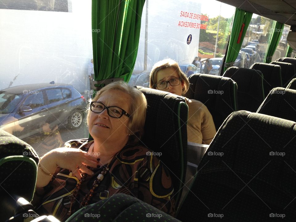 Senior woman sitting in bus