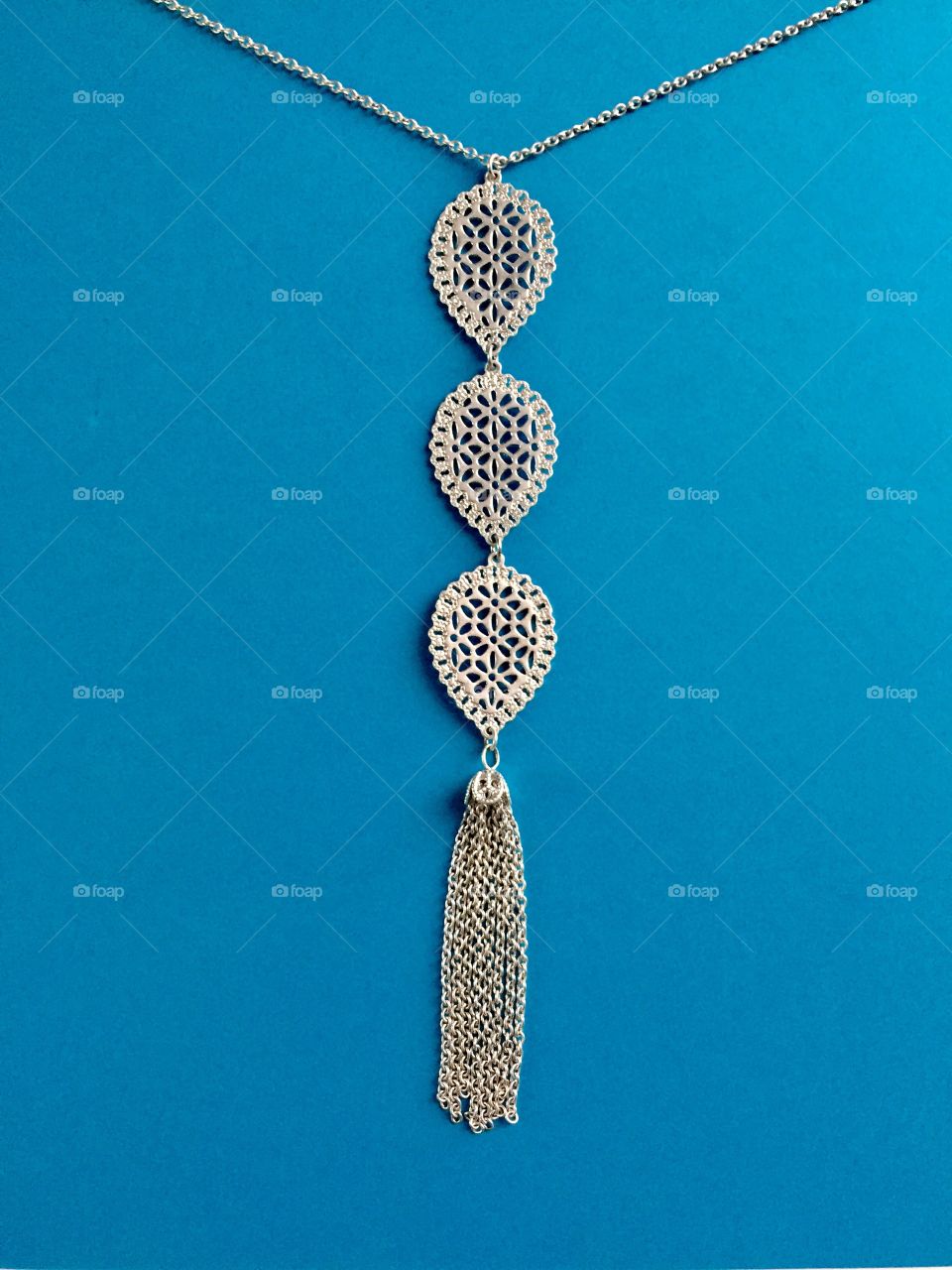 Close-up of tassel necklace hanging