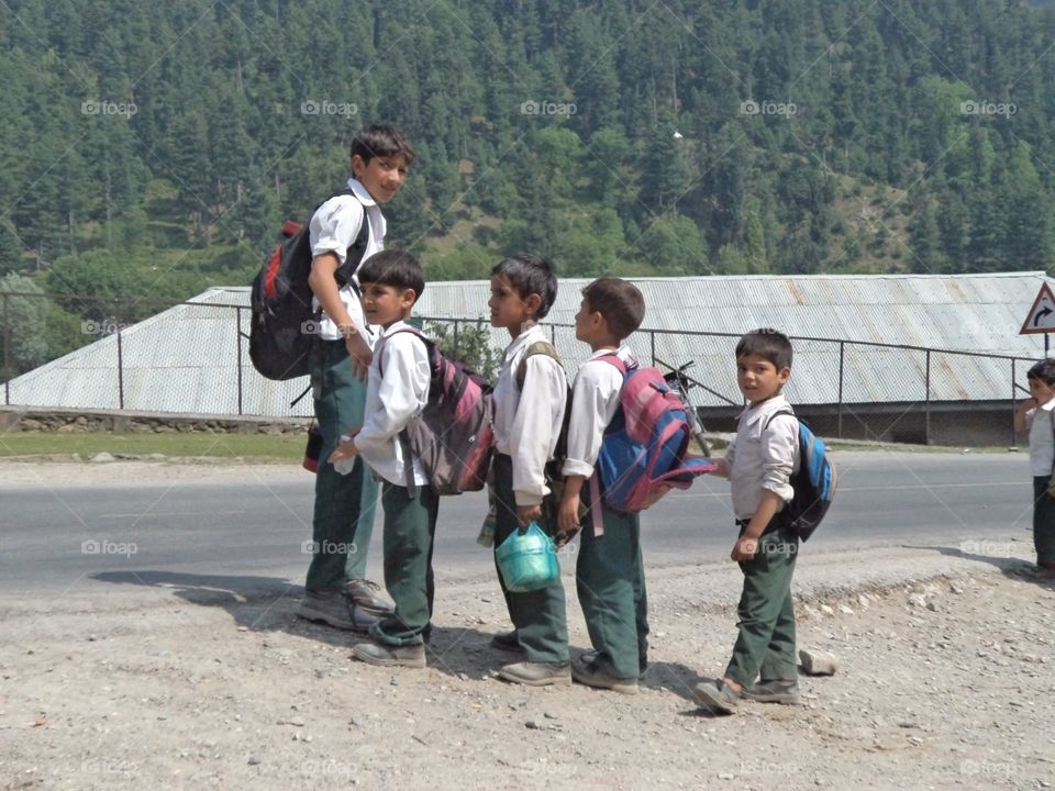 a bunch of kashmiri boys going to school