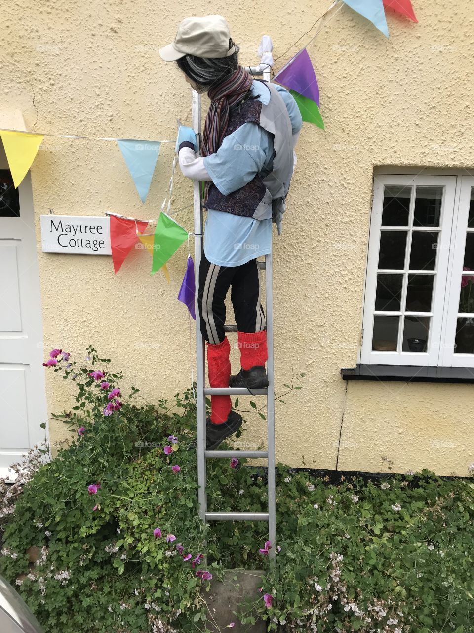 The first of two more scarecrows at this festival, this one is recognized easily as a result of the bright red socks.