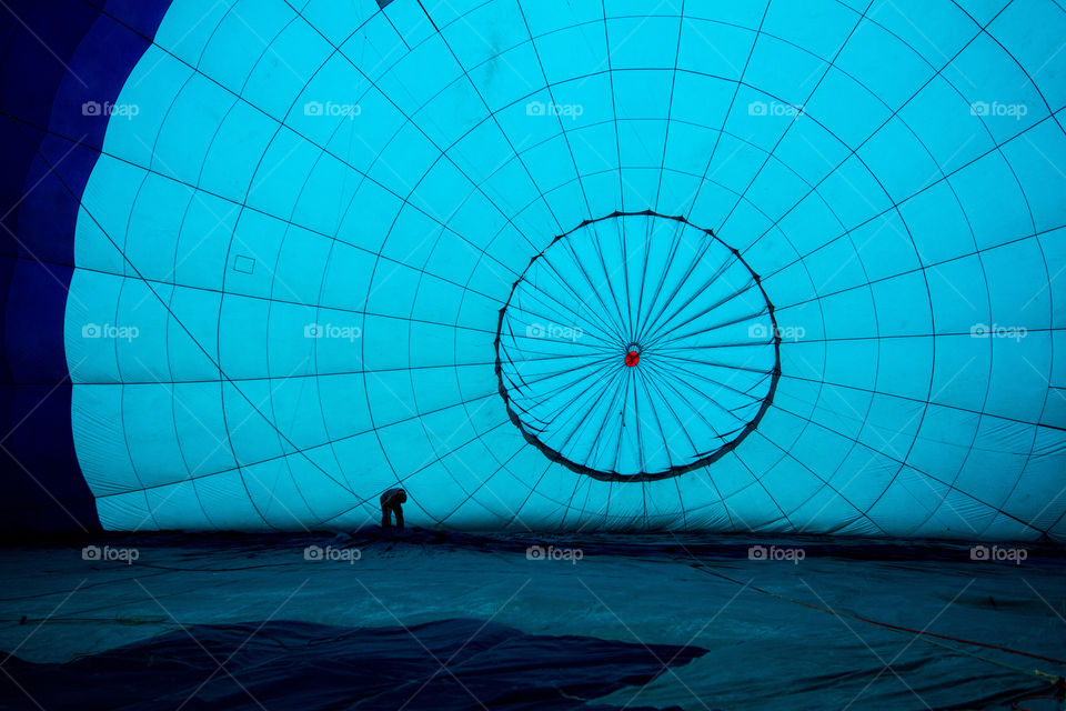 Love the blue hot air balloon with man preparing it for flight