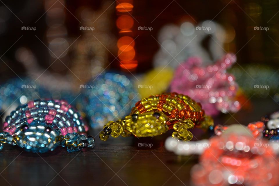 animals figured from beads close up background, art and craft hobbies