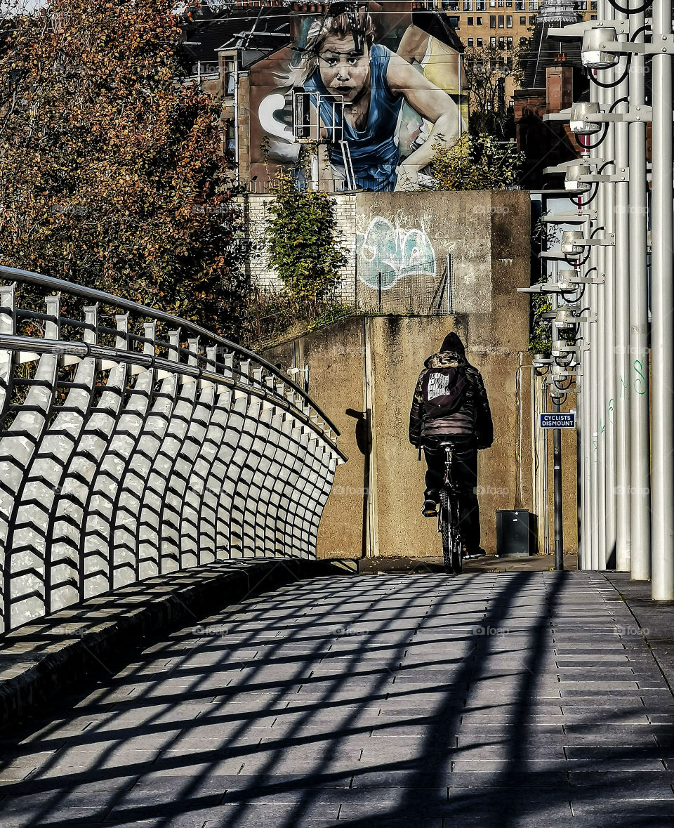 A man on the bike and shadows