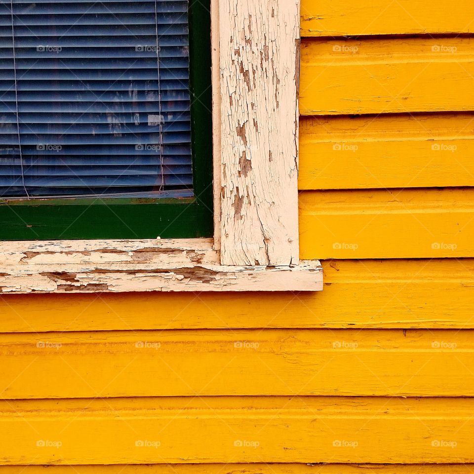 a window. a window with blue blinds.