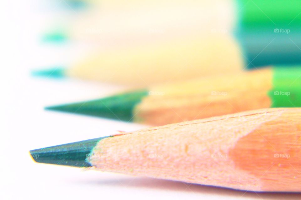 Macro of green colored pencils