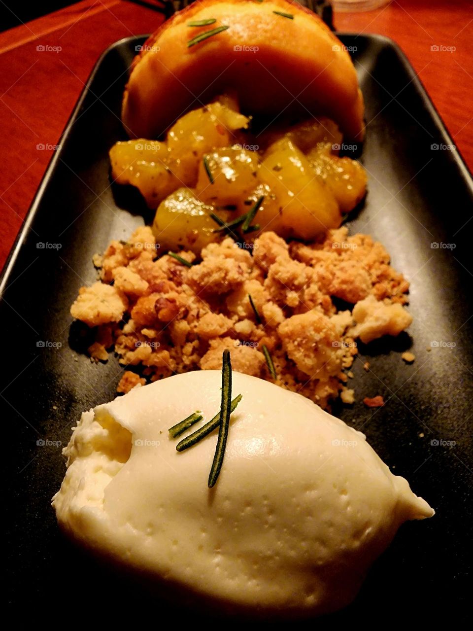 A delicious carrot custard cake featured creamy vanilla ice cream, cake crumbles and heavenly pineapple pieces