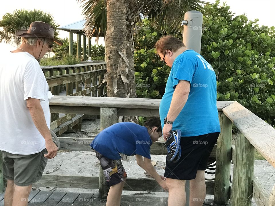 Three generations enjoying the beach.