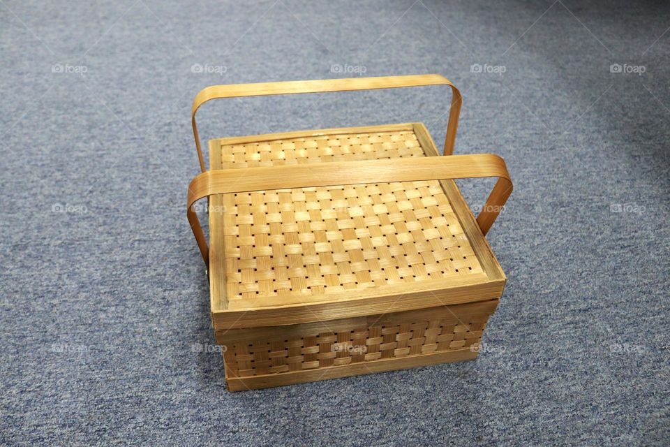 A picnic basket that usually contains fruit and food