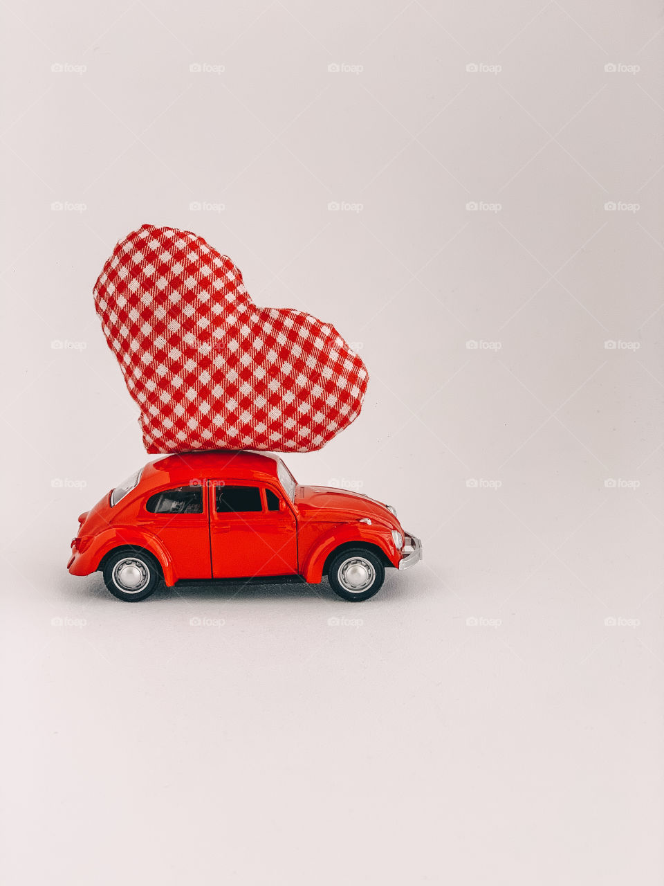 Red retro car with red heart