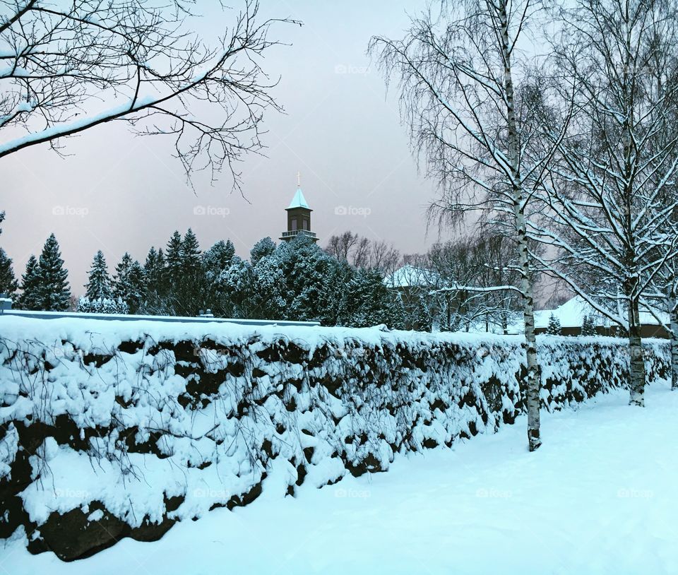 Church in a snowy landscape, snowy wall 