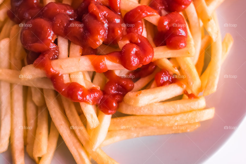 French Fries Potatoes With Red Sauce On Plate
