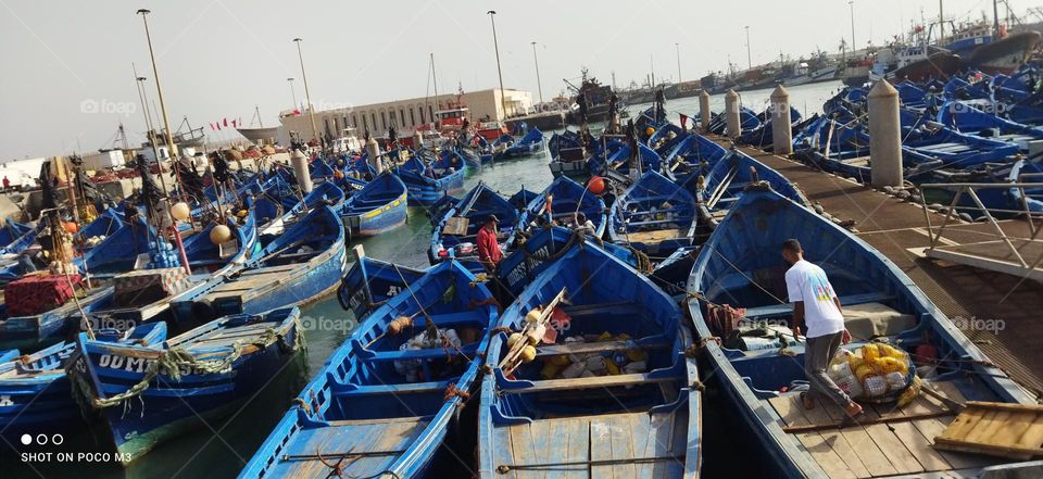 blue boats at the harbour in essaouira city in Morocco.