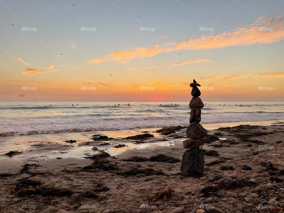 more rock cairns/stacks/balancing at the beach in San Diego at sunset