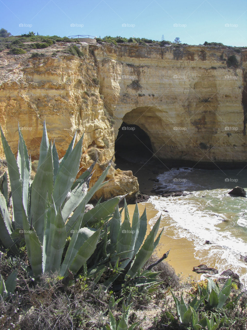 Beach with cave, Algarve, Portugal. 