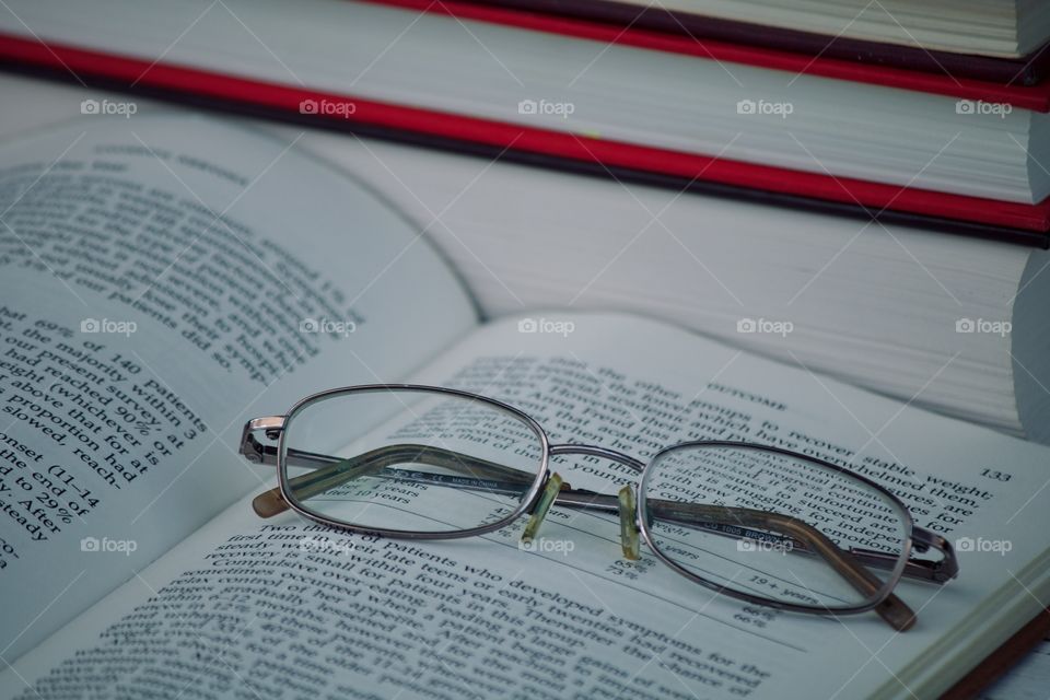 Reading glasses among books