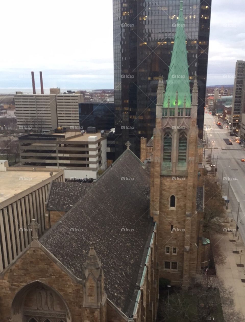 Church in Cleveland, Ohio. Beautiful lake scene beyond the city and stark contrasting architecture from high above.