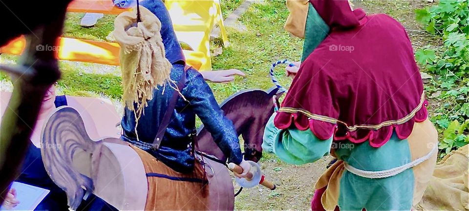 A boy rides a wooden horse in the “Bernauergarten” in “Straubing”, “Bavaria” at the rehearsal of “Da Albrecht und sei Agnes” expressing in Bavarian dialect the love for the historic “Agnes Bernauer” and Duke “Albrecht”. 2024. Hypnotic Productions