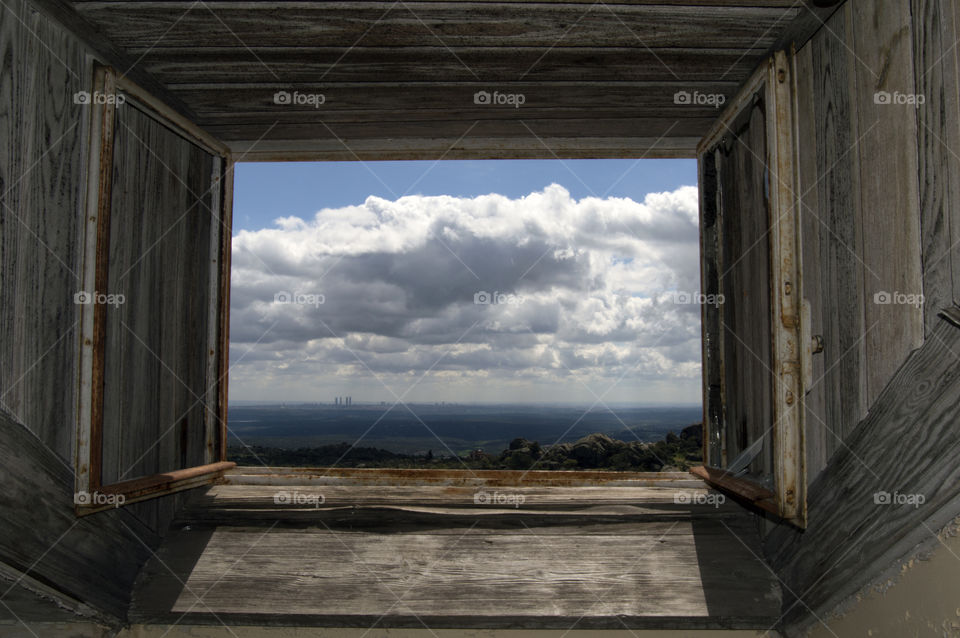 Scenic view of cloud scope through wooden window