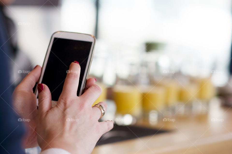 Typing on a smartphone in cafe