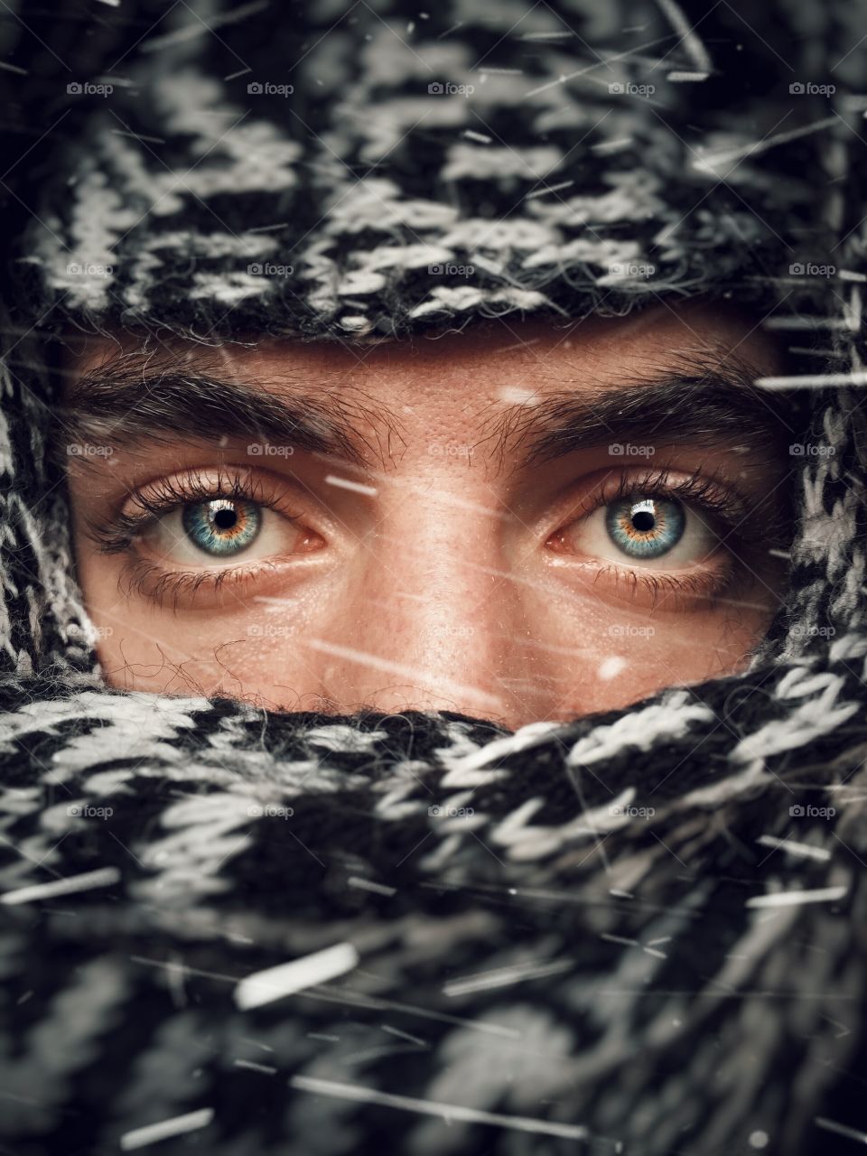 Close up shot of my nephew cower his face with scarf in cold winter day