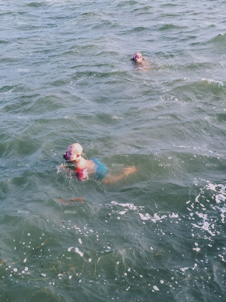 Boy swimming in the ocean