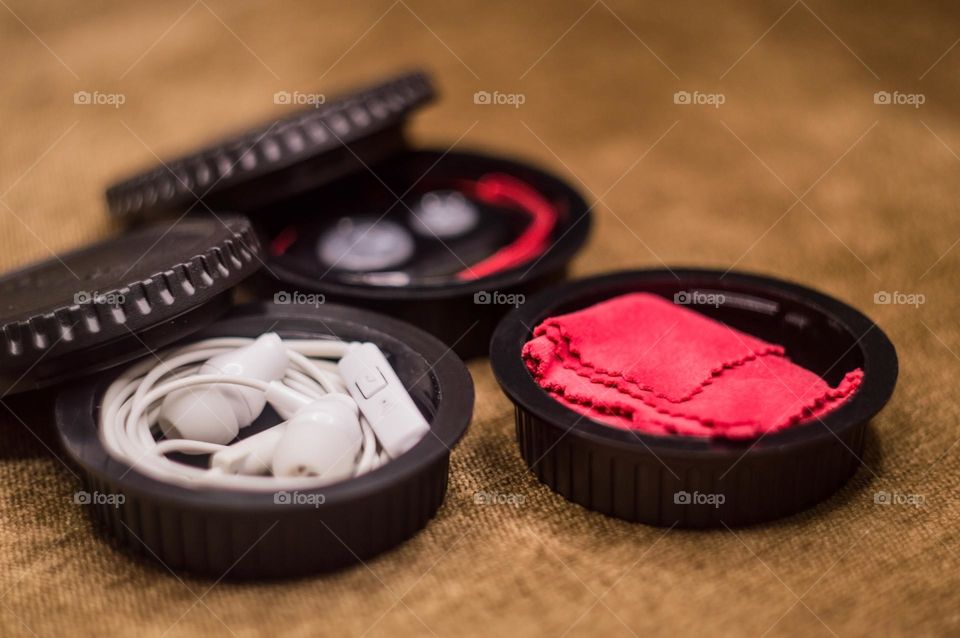 sometimes I put things in a lens cap so they don't get lost. I have headphones, a cloth and a remote control for the camera.