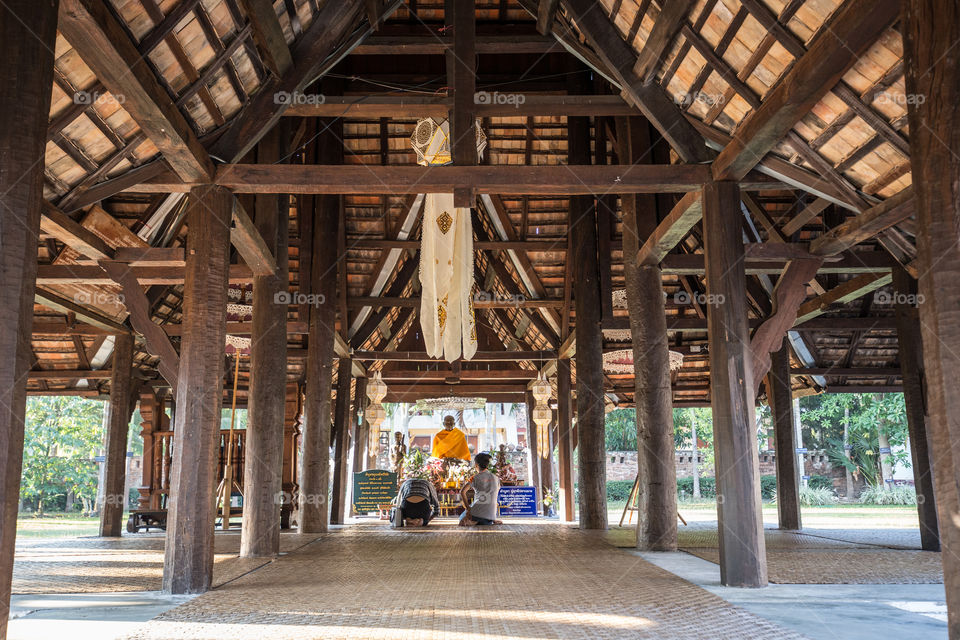 Tourist pray respect to the Buddha statue in temple 