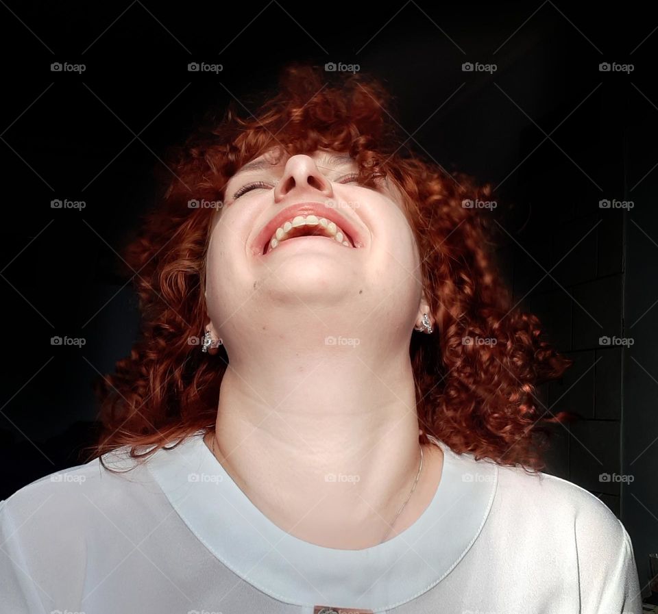 Photo of a girl who is happy with her red hair