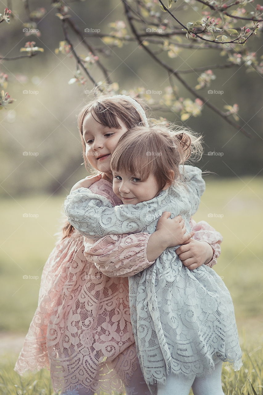 Little sisters in park