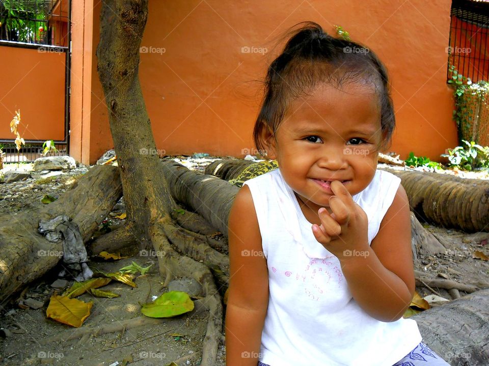 young asian girl smiling at the camera