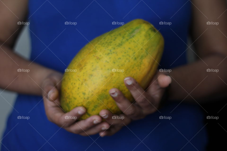 Holding papaya 
