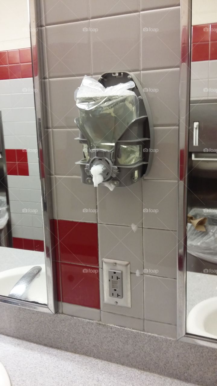 broken soap dispenser