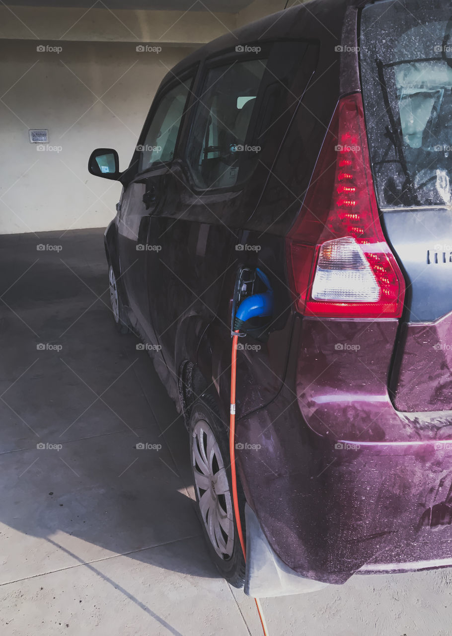 Electric car getting charged 