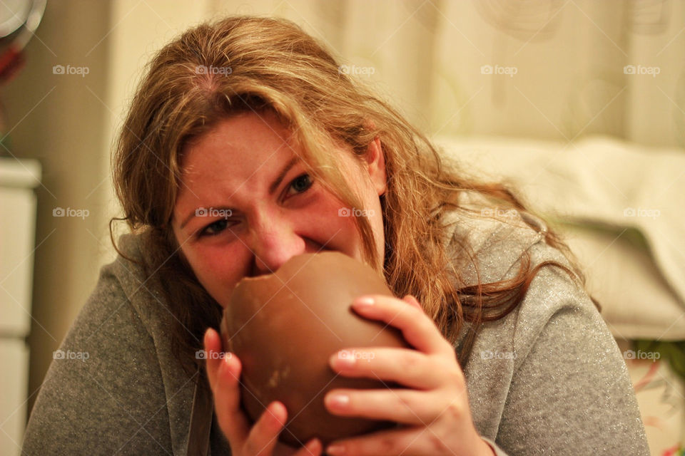 Girl eating chocolate - funny face