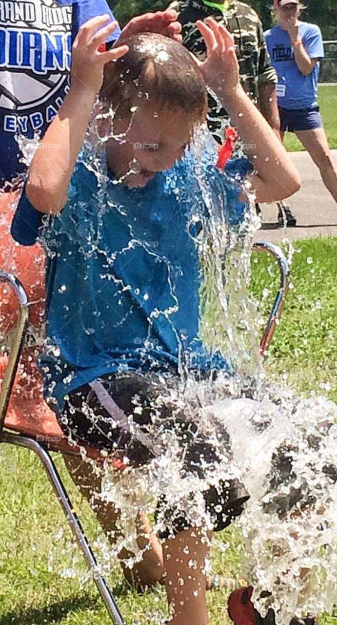 Close-up of a boy playing in field