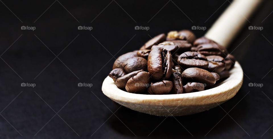coffee beans and beautiful wooden spoon