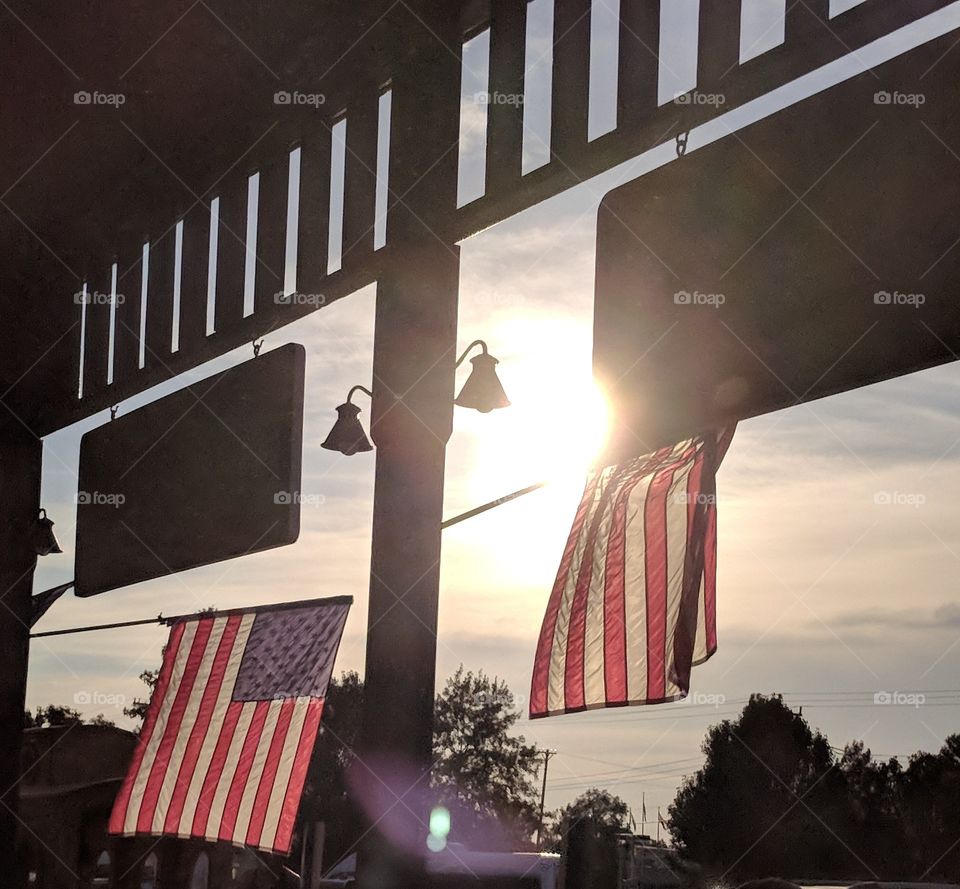 Flags at sunset at Lambert's cafe
