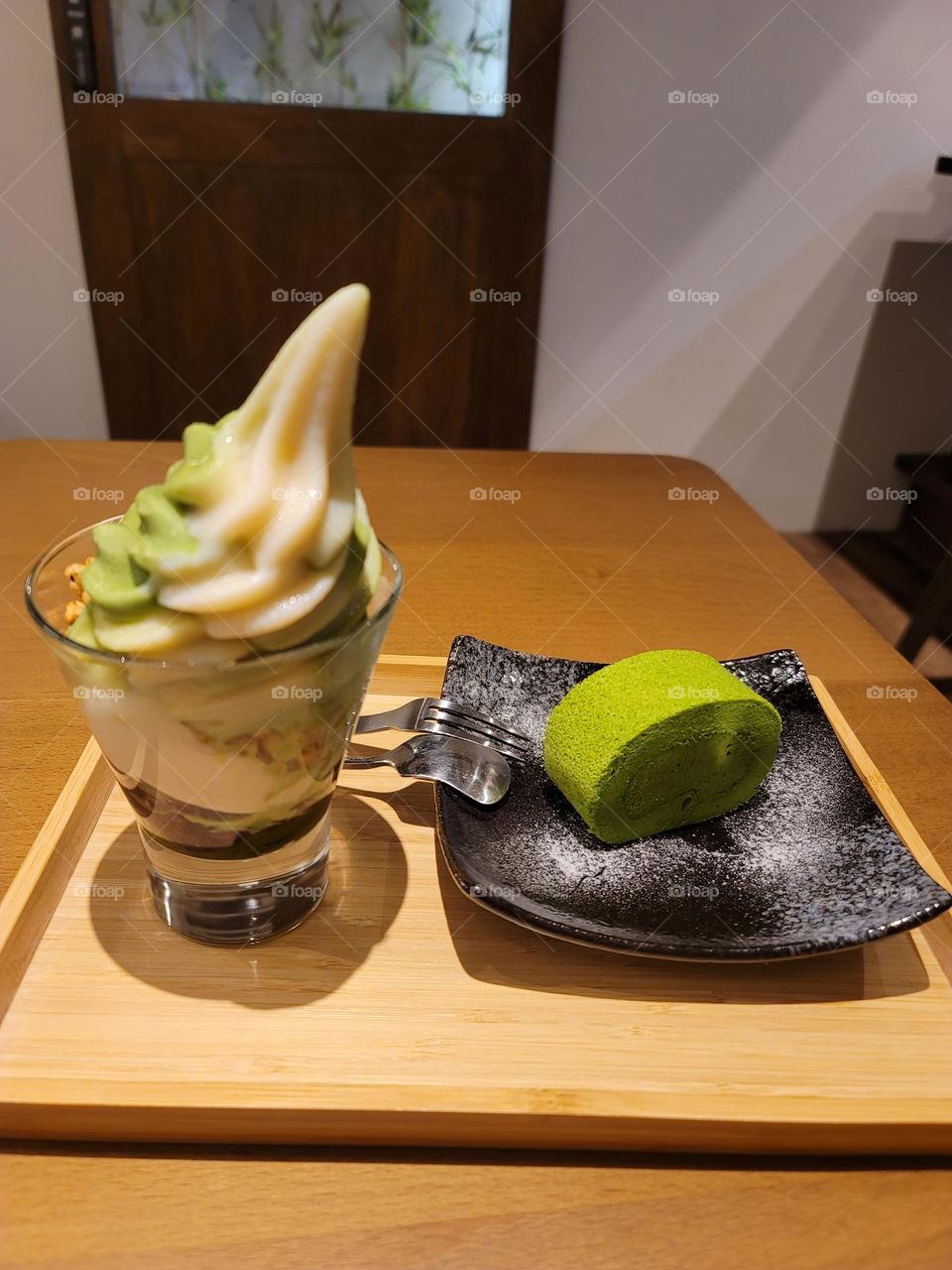 Matcha roll cake and matcha ice cream sundae .