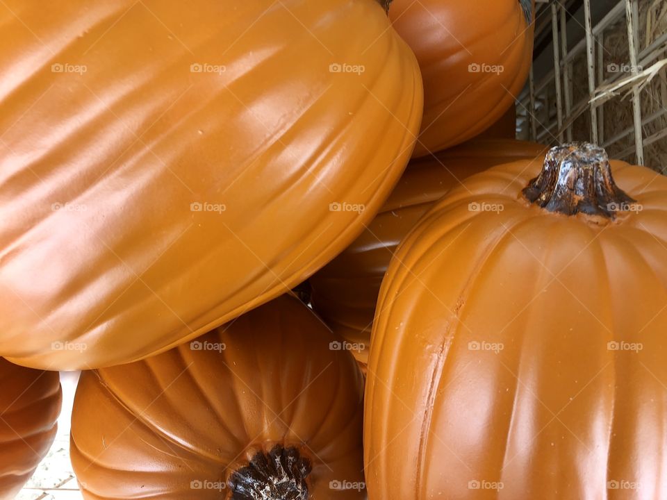 Group of plastic pumpkins in a metal crate for Halloween decorating