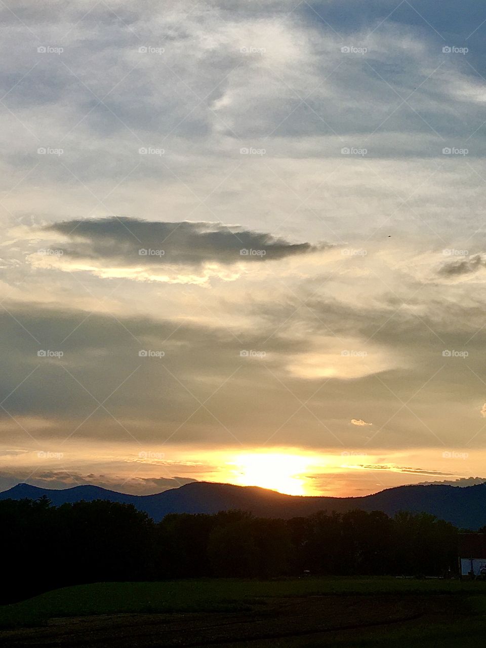 Sun setting behind the mountains 