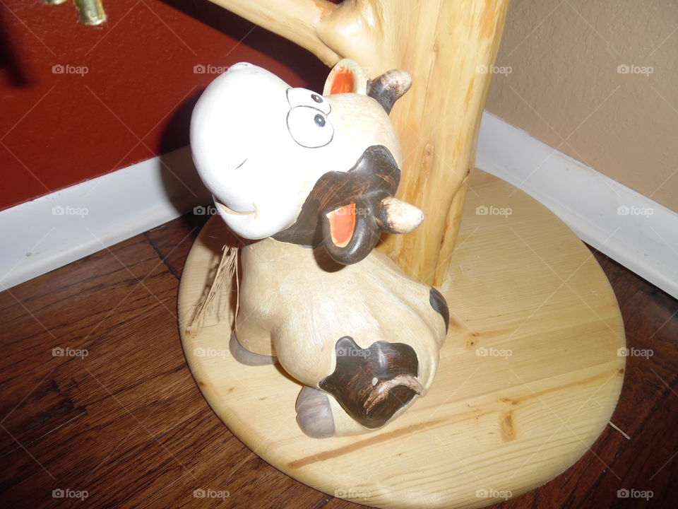 baby 👶 cow 🐮. This is a ceramic figure that sits on the wood floor of my house