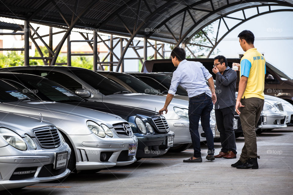 People looking for the car in the parking lot