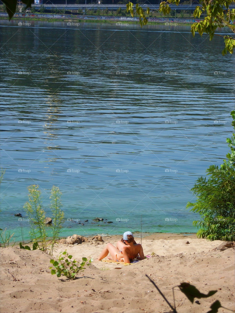 girl sunbathing on the plan in Hydropark in the city of Kiev