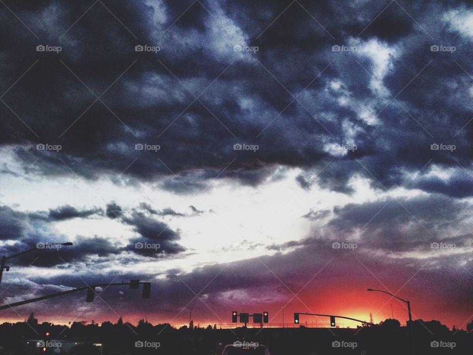 Dark clouds over golden sunset 