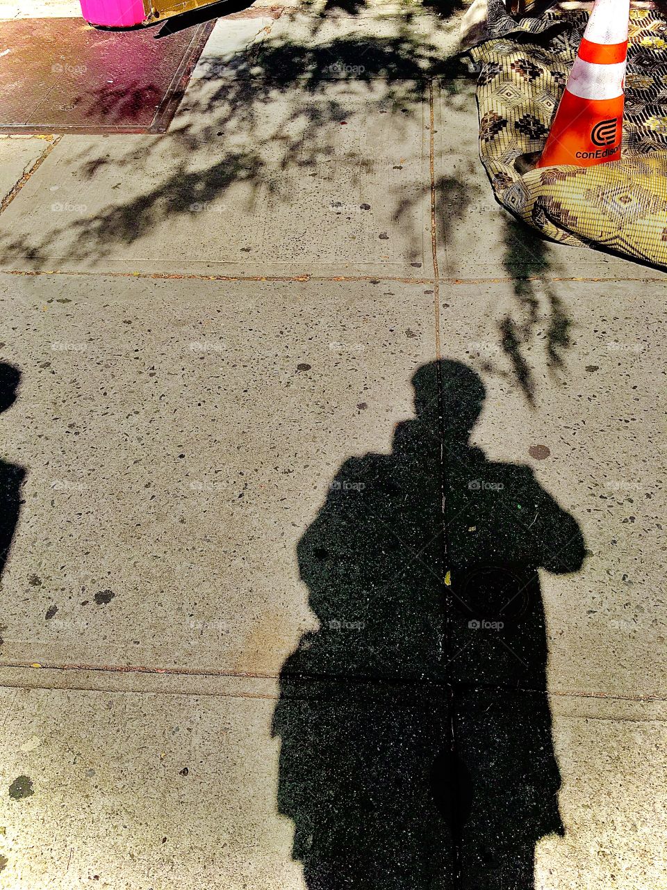 Casting my own shadow while taking this picture somewhere along Fulton Street in Forest Green, Brooklyn, New York. This photo was taken in the summer of 2020. Hypnotic Productions