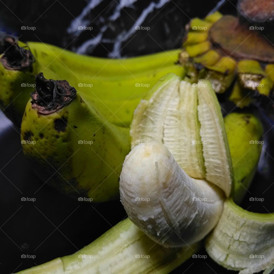 Delicious green banana fruit on the table