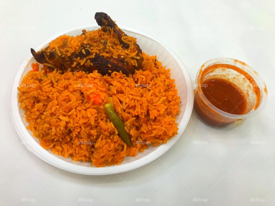 Arabian Kabsa Rice with sauce white background 