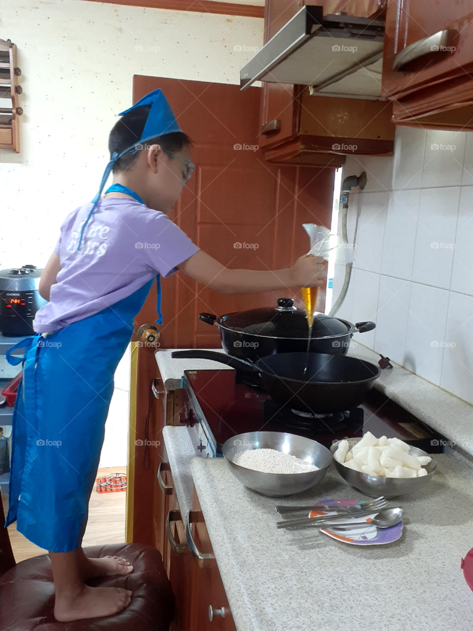 pouring the honey in the pan. use a medium heat and stir it while waiting to bubble.