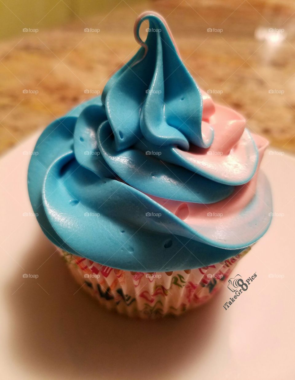 Swirled Cupcakes made by Khila and Ruby.  Yummy confetti cake cupcakes with vanilla icing.