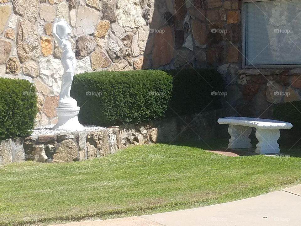 statue and Bench outside a funeral home